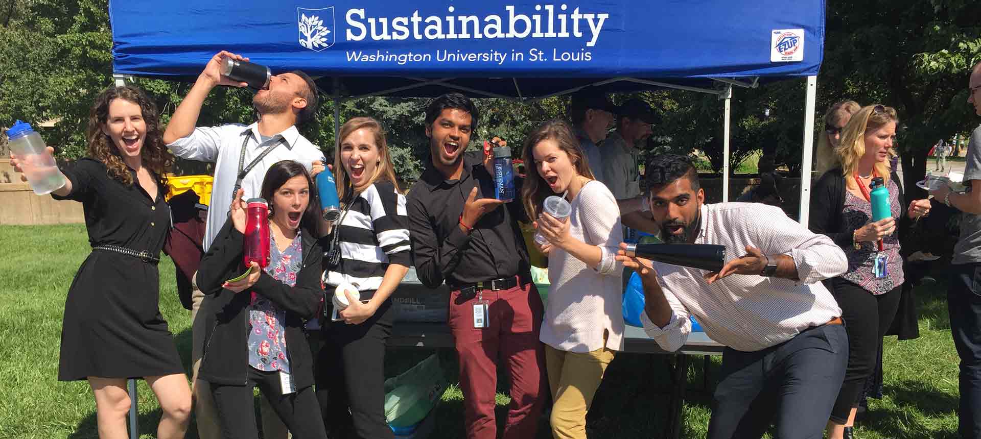 Students at Washington University in St. Luis in front of a sustainability event tent