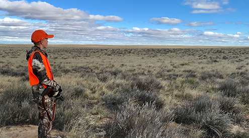 young hunter in sagebrush steppe