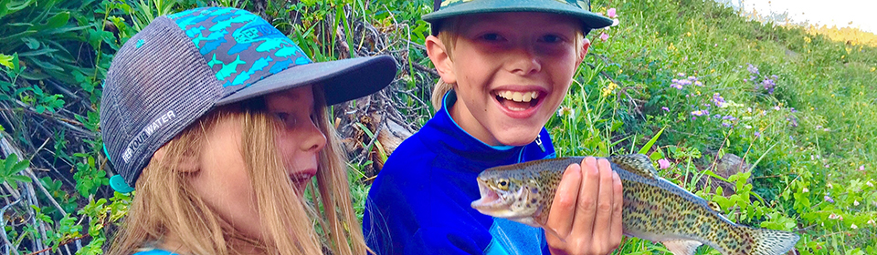 Boy and Girl holding fish